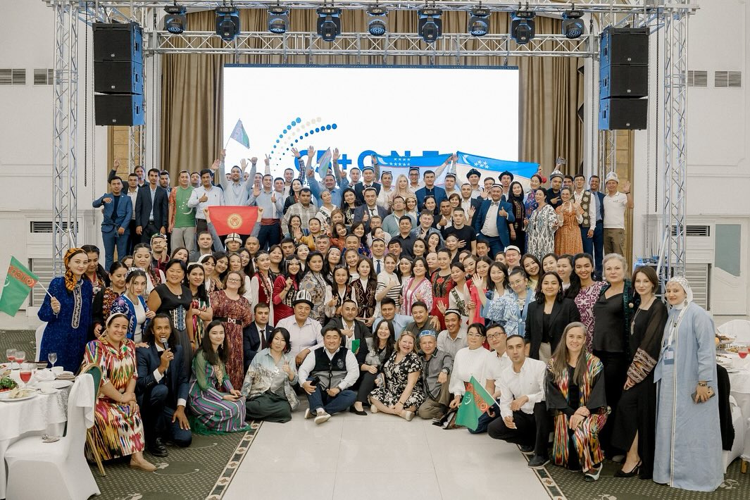 C5 + O.N.E. Group Photo with Flags _ AC Kazakhstan