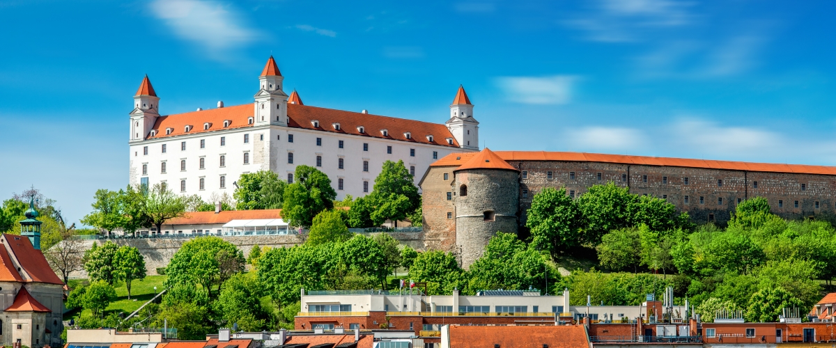 View on Bratislava castle on the green hill with old houses at the bottom from the Michael's watch tower in Slovakia